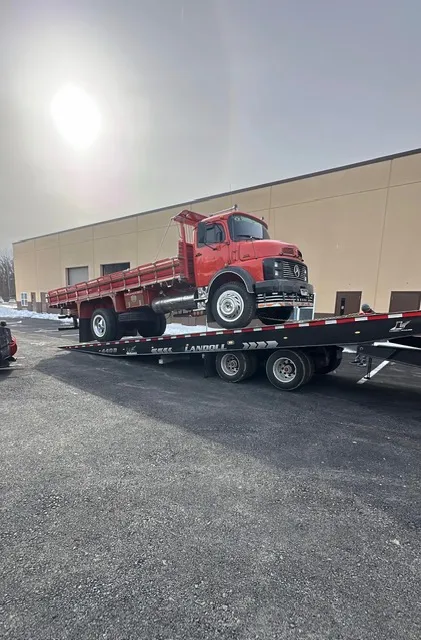 Specialized vehicle transport on flatbed